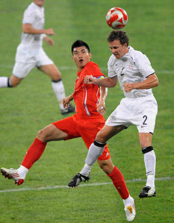 Aaron Scott of New Zealand (2) battles for the ball with China's Zheng Zhi during a football match on Aug. 7, 2008 in the Summer Olympics. The match finished 1-1 in Shenyang, China.