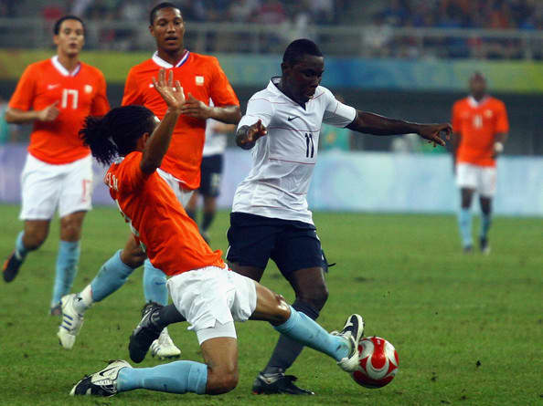Freddie Adu of the United States competes for the ball with the Netherlands' Urby Emanuelseon during a group stage match in Tianjin, China. The Netherlands and the United States played to a 2-2 draw, a result that proved costly for the United States.
