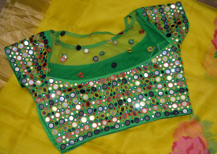 bright green multi coloured blouse that would look great at mehendi ceremony or holud ceremony with lehenga or net saree
