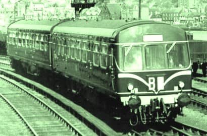 An early Metro-Cammell diesel multiple unit with 'speed whiskers' leaves Whitby Town station for the Esk Valley. Livery was initially Brunswick Green lined in cream, later with yellow panels around the route describer (code) box below the windscreen