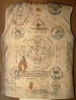 A Vest worn by a Filipino Revolutionary during the Philippine Revolution circa late 1890s-early 1900s. Contains Folk-Catholic prayers in peasant's butchered Latin, and instructional diagrams on when or where the shirt would work.