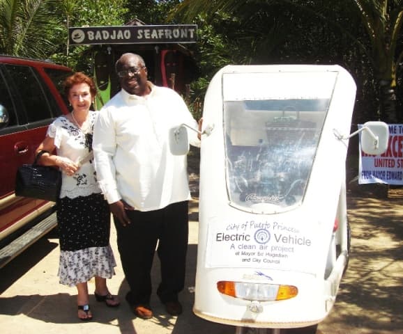 Helen Limjoco wth US Ambassador Harry K Thomas, Jr., at Badjao Seafront Restaurant in Puerto Princesa Palawan with our electric Tricycles.