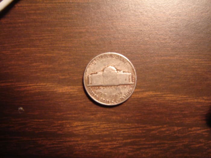 Normal nickel before1980. Note small "D" at right of building. This is a 1953, a common date and mint.