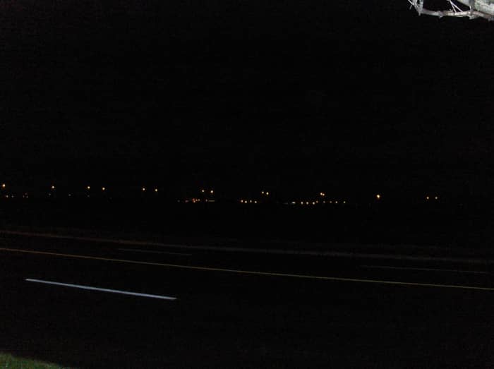 Taken about the same time and location...picture was to be of an explosion happening near the row of lights in the background...notice no orb. copyright by Scribenet
