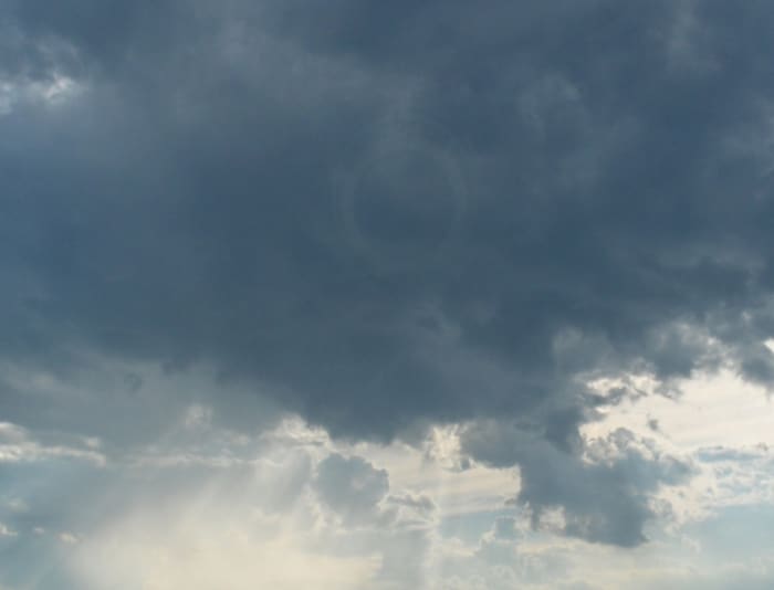 Look closely, there is a ring in the sky...but I think this is caused by the camera, because it looks like the aperture of the camera by it's placement. how this happens, you would have to ask a camera expert!