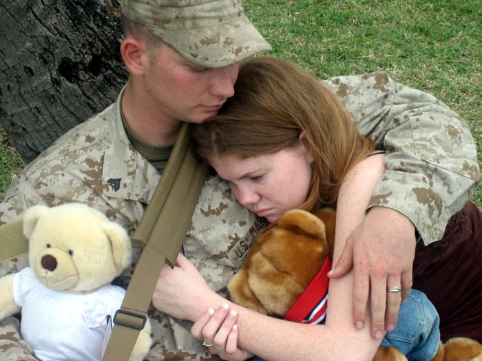 Cpl. Tyler Cobaley, an armory custodian for Lima Company, 3rd Battalion, 3rd Marine Regiment, spends a few moments with his wife under a tree at Marine Corps Base Kaneohe Bay, Hawaii, before saying‘good-bye’ to his wife, Patricia, and deploying.
