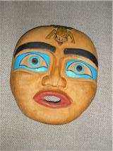 My very first carving-a flat mask made from yellow cedar and roughly carved, but I loved it.