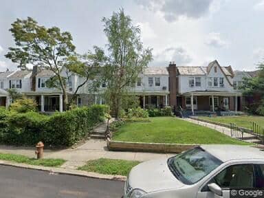 The row house to the right of the hedge is where we lived in Philly. To the far right you can see the Iroquois Apartments.