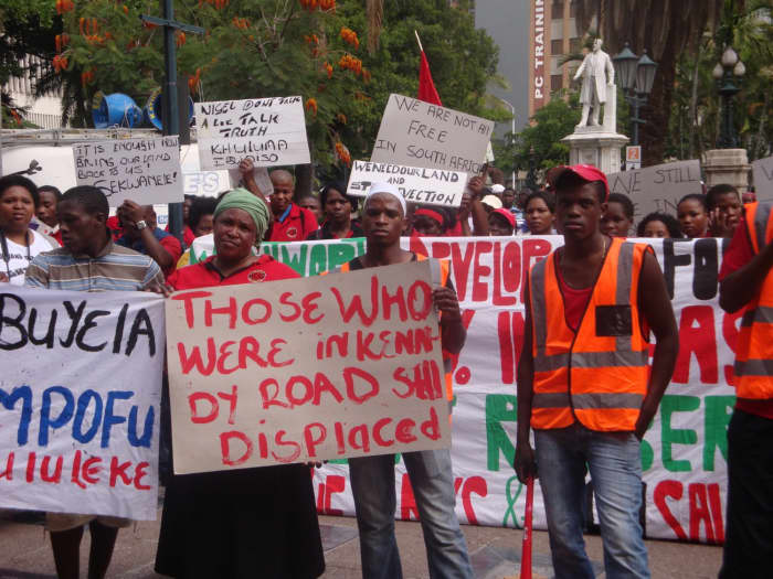 The Abahlali baseMjodolo craftily and skillfully use Posters to voice and disseminate their discontent and demands.. See Posters in this Picture