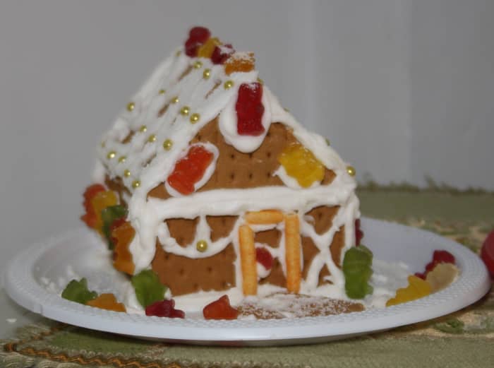 Another Graham Crackers Gingerbread House with Haribo gums candies and golden sugar dots decoration.