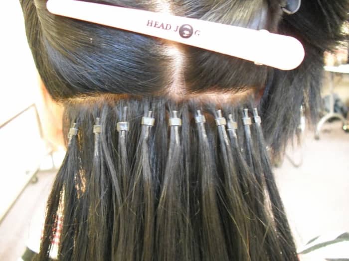 Micro-ring extensions - Notice the individually ringed hair sections and how each micro-loop is installed..
