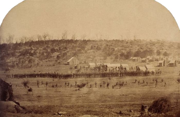 Photo of a Skirmish Drill. The dispersed troops in the foreground are the Skirmishers. The Line of Battle behind them is the remaining eight or so Companies of the Battalion