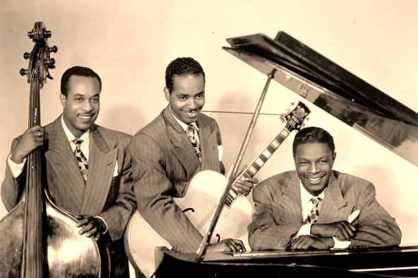 The King Cole Trio : Nat King Cole on the piano, Oscar Moore on Guitar and Wesley Prince on the Doube Bass