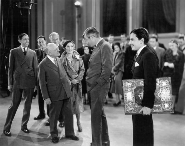 February 6,1931. Photo of a celebration of Carl Laemmle's 25th anniversary in motion pictures. At back, from left-Will H. Hays, Irving Thalberg, Cecil B. DeMille. Front from left-Carl Laemmle, Mary Pickford, Will Rogers and Carl Laemmle, Jr.