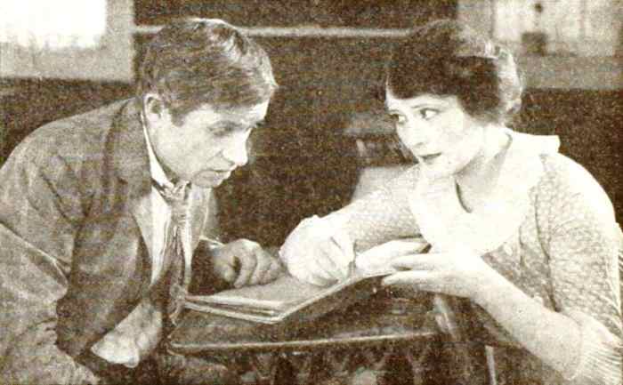 A Still from Boys Will Be Boys (1921) with Will Rogers and Irene Rich, on page 57 of the August 1921 Photoplay.