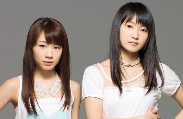 Ayumi Ishida (left) of Sendai, Japan is pictured here with Riho Sayashi during a photo session for Hello! Project.