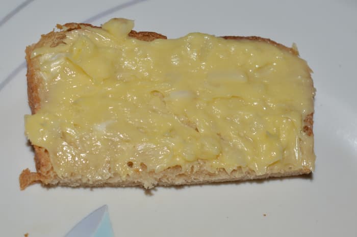Step one: Mix butter and finely chopped garlic in a bowl. If you are using salt less butter, add some salt and mix well. Spread it evenly on the top side of all the bread slices.