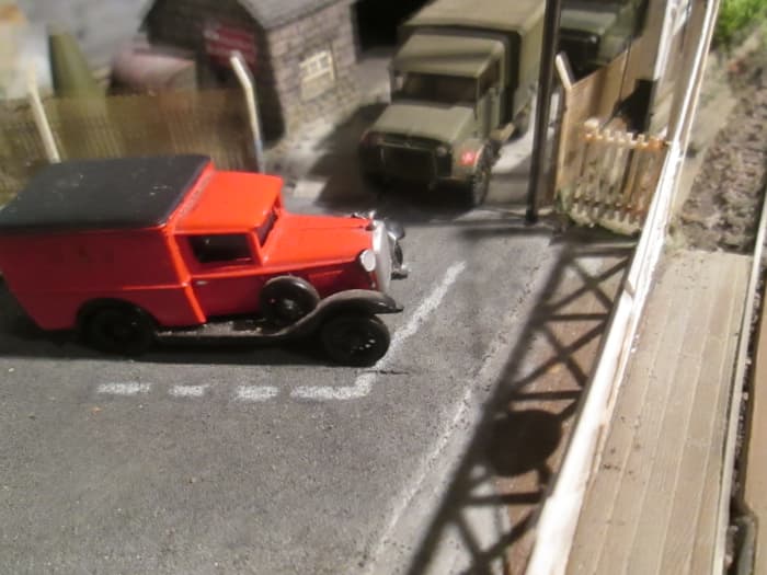 A level crossing might feature, look at period pictures for warning signs - what kind, where - and check out the vehicles in traffic, waiting to cross or passing over