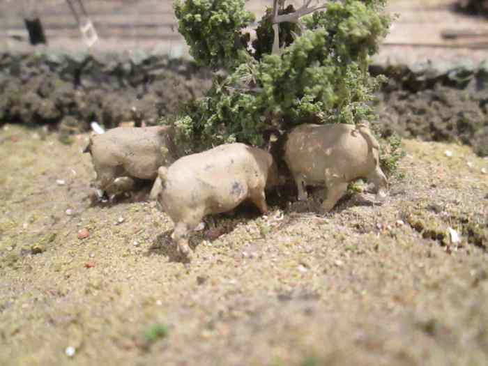 And don't forget livestock. Here are a few pigs rooting under a small tree... what for? Your fields and surrounding land give clues