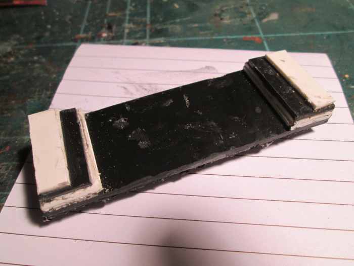 ... And the underside, the plastic strip built up to sit on the hopper slope inside the wagon.
