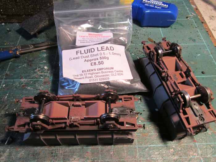 'Fluid lead' in a 500 g bag from Eileen's Emporium - lead shot, the same as you get in a shotgun cartridge! Better than steel ingots because you can 'pour' it into a small space, whereas you'd have to saw the ingot or make-weight
