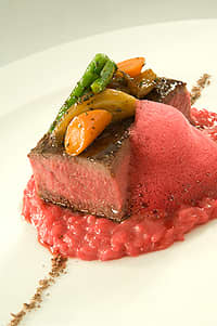 Pepper Crusted Strip Steak with Chocolate Salt, Beet Risotto, and Beet Foam. Photo courtesy Rosendales.