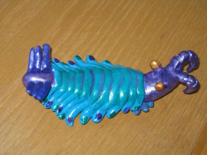 This is a clay model I sculpted of an Anomalocaris and painted with the color scheme of a Peacock Praying Mantis Shrimp.