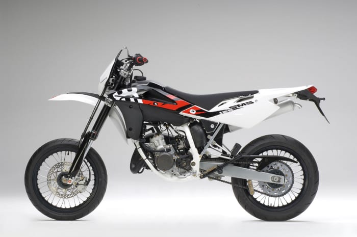 The outrageous 2009 Husqvarna SM125: Add about a thousand dollars, shop around, and you can drive home on a 2009 Harley Davidson Sportster. Is anyone crazy enough to actually buy this thing at this price?