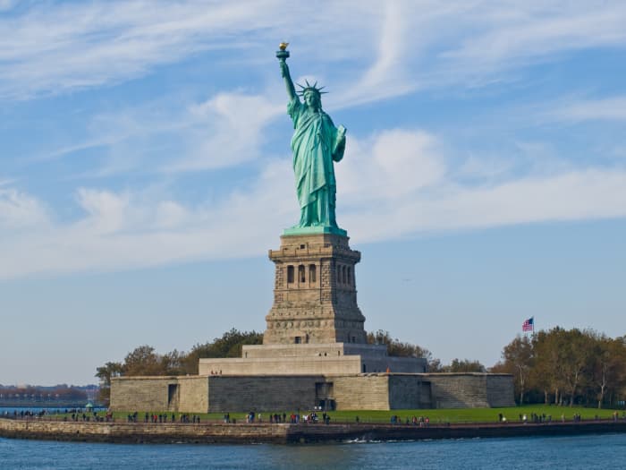 The Statue of Liberty is located on Liberty Island in New York. Given to America as a gift by France, it was one of the first parts of America to be seen by many immigrants from Europe. Photo by wwarby and distributed under Attribution 2.0 license.