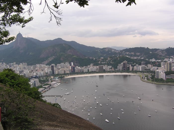 View of Rio de Janeiro in Brazil. The statue Christ the Redeemr can just be seen in the top left of this picture on top of the hill. Distributed under Creative Commons Attricution-No Derivative works license, the photo is by Chang'r.
