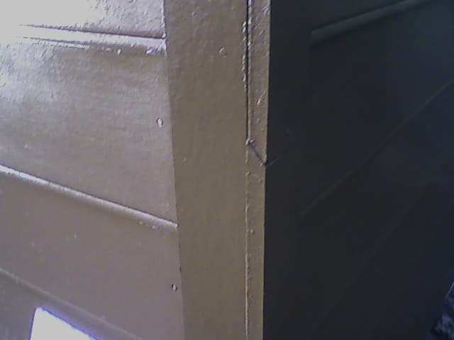 Piecing corner trim. Note the downward-sloped 45-degree cut. You'll note that I chickened out on "blind-nailing" the boards--I didn't trust that quarter inch overlap.
