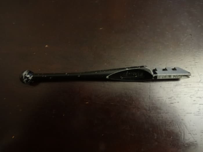 This is a glass cutter which can be a gift for the guitar player to make his own slide or you can use it to make him a slide. It's not really easy, but if you take your time...