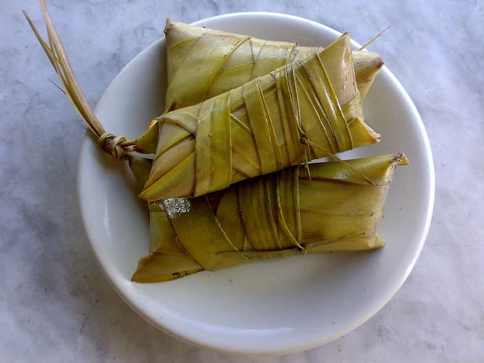 ibos -- a variety of suman -- from rice sticky cooked with sugar and coconut milk covered with coconut leaves