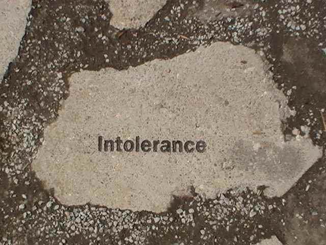 Paving Stones line the walkway surrounding the monument. One contains a brief history of the Wall in Germany. The rest contain a single word: Indifference, Distrust, Judgment, Ignorance, Prejudice, Control, Fear, Selfishness and Intolerance.