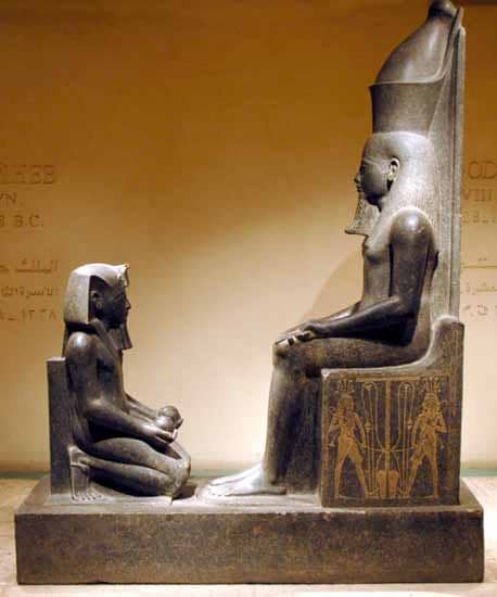 Pharaoh Horemheb kneeling before Atum. In the picture Horemheb is holding two spherical vessels ad is wearing the Nemes head-dress, uraeus, royal beard, shendyt-kitt and sandals