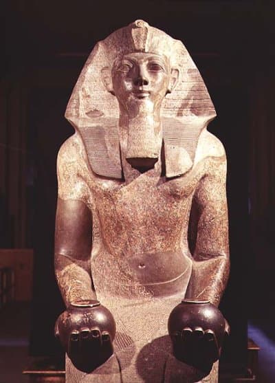 Hatshepsut(Maatkare) is depicted in a fake beard and with objects that a Pharaoh is usually depicted with, and in male attire, after a few years of ruling in female form