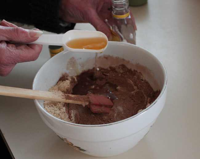 Bundaberg Rum being added to the mixture. 2 for the mix, one for the cook :) :)