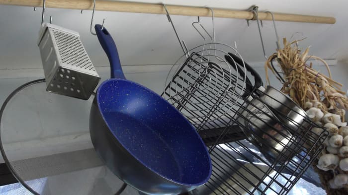 Anything with a hole in it can be suspended on hooks in your off grid kitchen