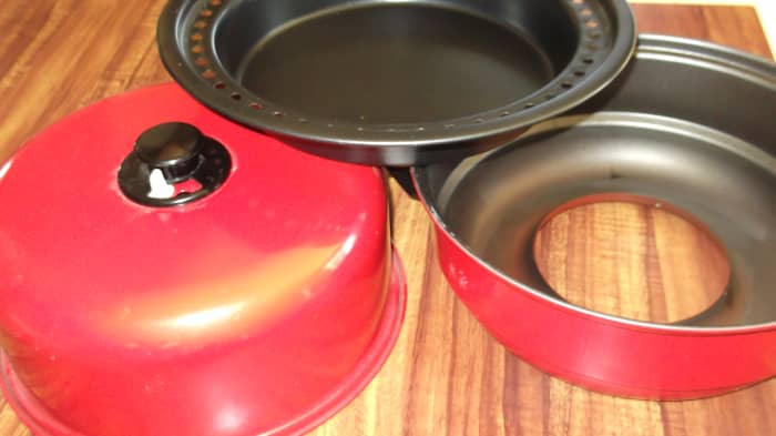 I have no idea what this is called. I threw away the box long ago. But if you see one, buy it. You can even roast a chicken in here, nice and clean, on top of a wood burning stove. See text for details.