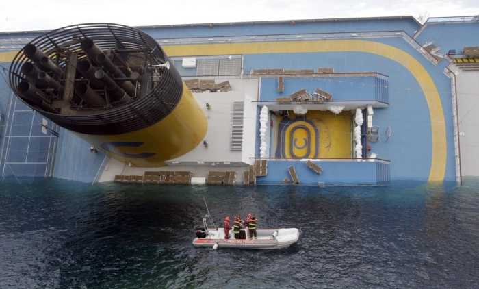 This shows just the sheer size of this ship compared to the search boat. Amazing how it even floats!