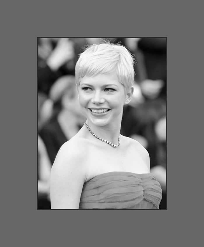 Michelle Williams wears pixie hairstyle with short cropped bangs that is very chic and makes her round face looks longer - 2013 Hairstyles with Bangs for Round, Oval, Square, Heart, Oblong Face