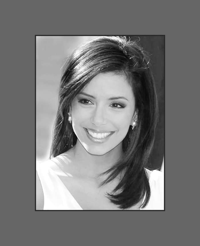 Eva Longoria is wearing long layered bangs neatly side swept showing her beautiful oval face - 2013 Hairstyles with Bangs for Round, Oval, Square, Heart, Oblong Face