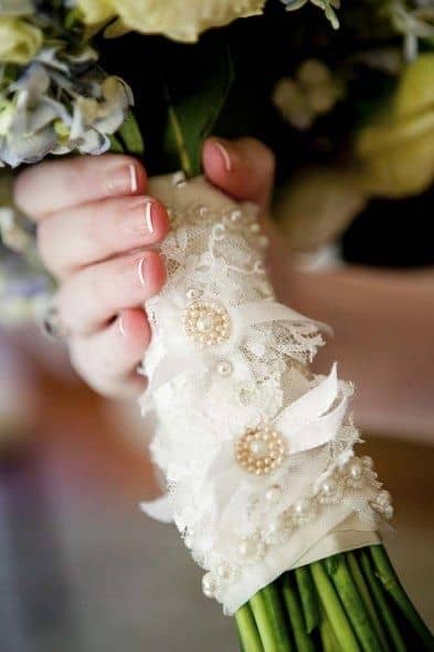 A simple bouquet wrapped with a lace wrap decorated with gems is a graceful touch to your lace wedding