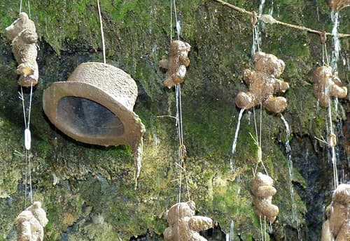 A few of the petrified teddies and a hat hanging under the rim of the Dropping Well. The nature of the limestone in the water over time brings about a change in the outer composition of the items, but eventually the whole 'body' will be ossified