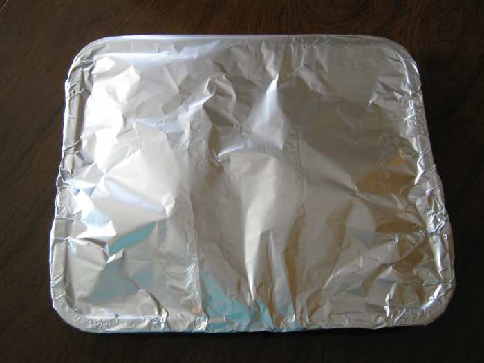 Step 8: Pour mixture into baking pan and cover with foil (shiny side towards food).. Ensure foil is sealed tightly around edges of pan.