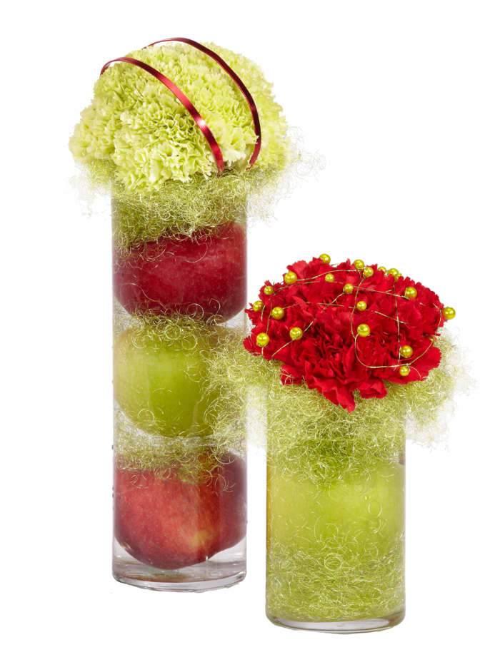 OK, so this isn't a candle centerpiece, BUT, you can use the same technique, fill your cylinder vase with fruit, sisal and more fruit, then float a candle on top. Simple, quick inexpensive.