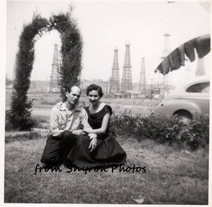 Dad and Mom the day after we moved into the house in California. You can see the oil wells where we found the pigeon.