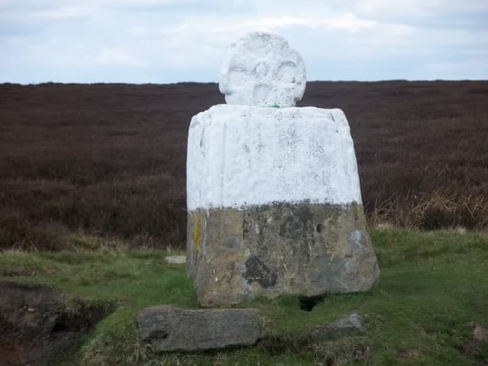 A little way on from the Lion Inn, meet Fat Betty. She won't hurt you, go on up and greet her (she's a worn old waymarker cross) and take something. Leave something in exchange, though, or you might just be cursed!