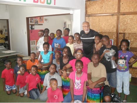 Students New Mirawood Academy pose with Willie after a lesson from his Rhythm of Africa Music Program, which aims to create positive behavioral and cognitive impact through the children’s exposure to and intimacy with learning and making music.