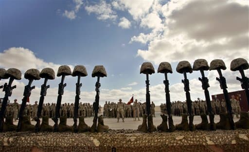 The Soldiers Cross is a tribute to a fallen soldier or Marine and is made from the boots, rifle and helmet.